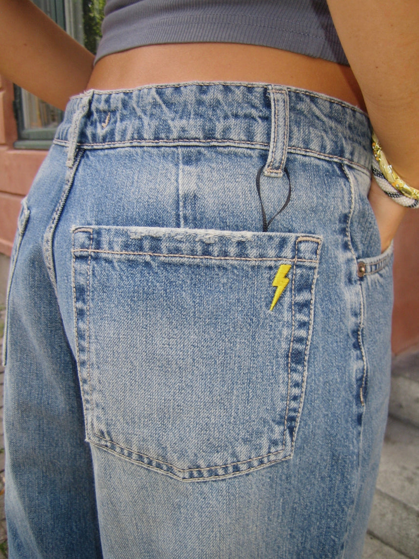 Alaia low-waisted jeans with lightning detail - Light denim