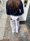 Star jeans with brown stars - White