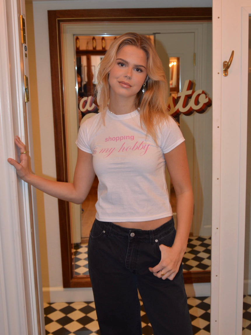 "Shopping is my hobby" baby tee - White
