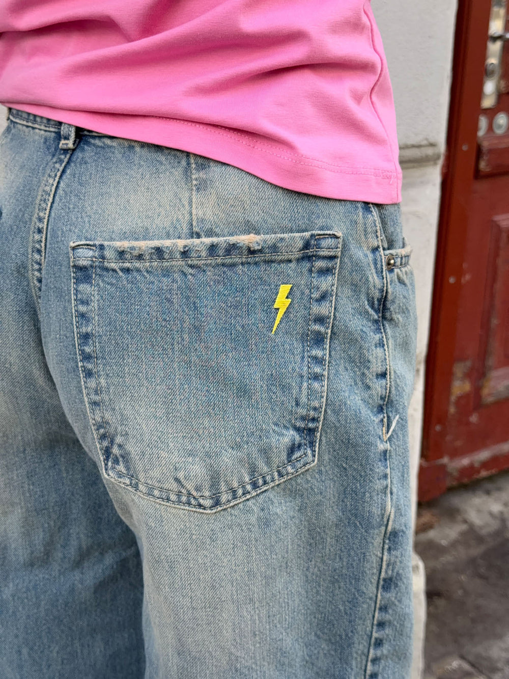 Alaia low-rise jeans with lightning detail - Light denim
