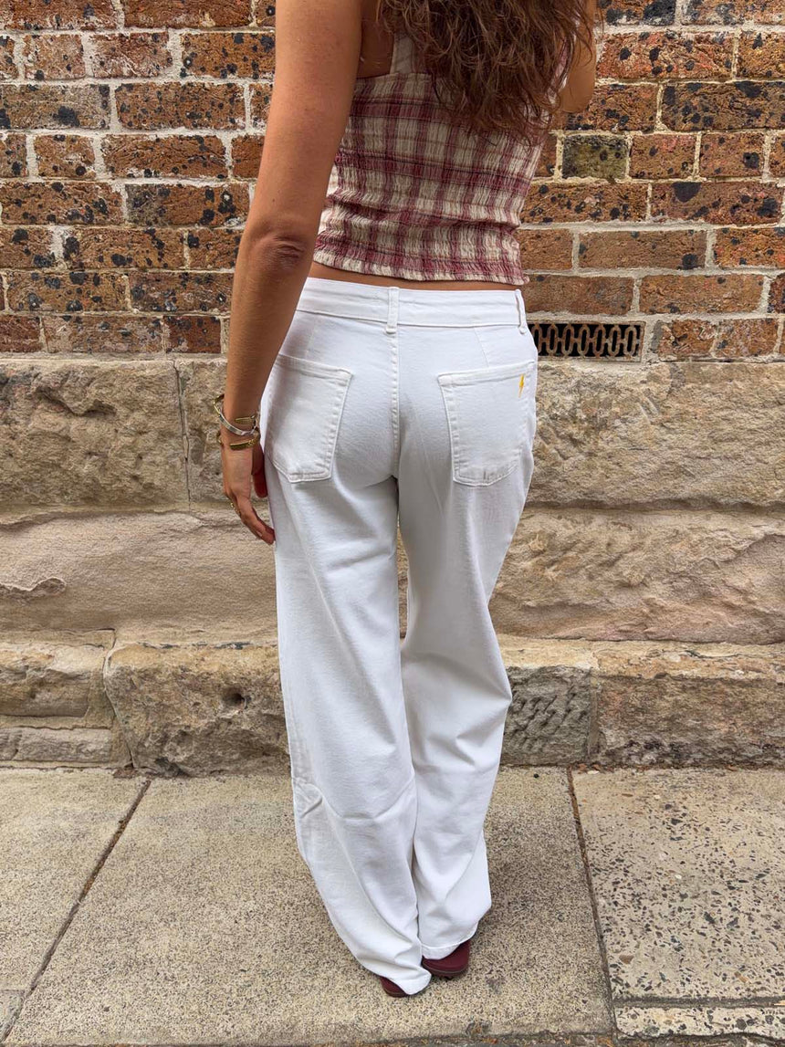 Alaia low-waisted jeans with lightning detail - White denim