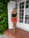 Stassy mini skirt with tie detail – Orange